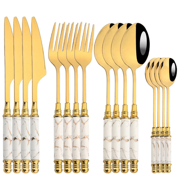 Set aus Edelstahlbesteck mit goldenen Akzenten und Marmgrifflingen