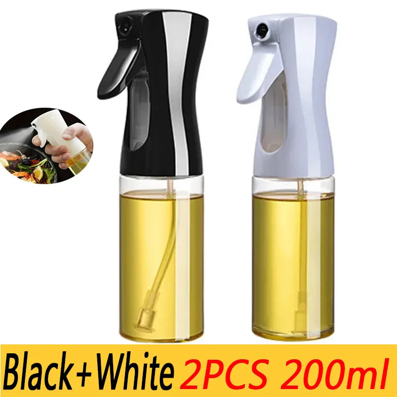 A set of two black and white oil spray bottles for cooking and baking, each containing 200ml of liquid.