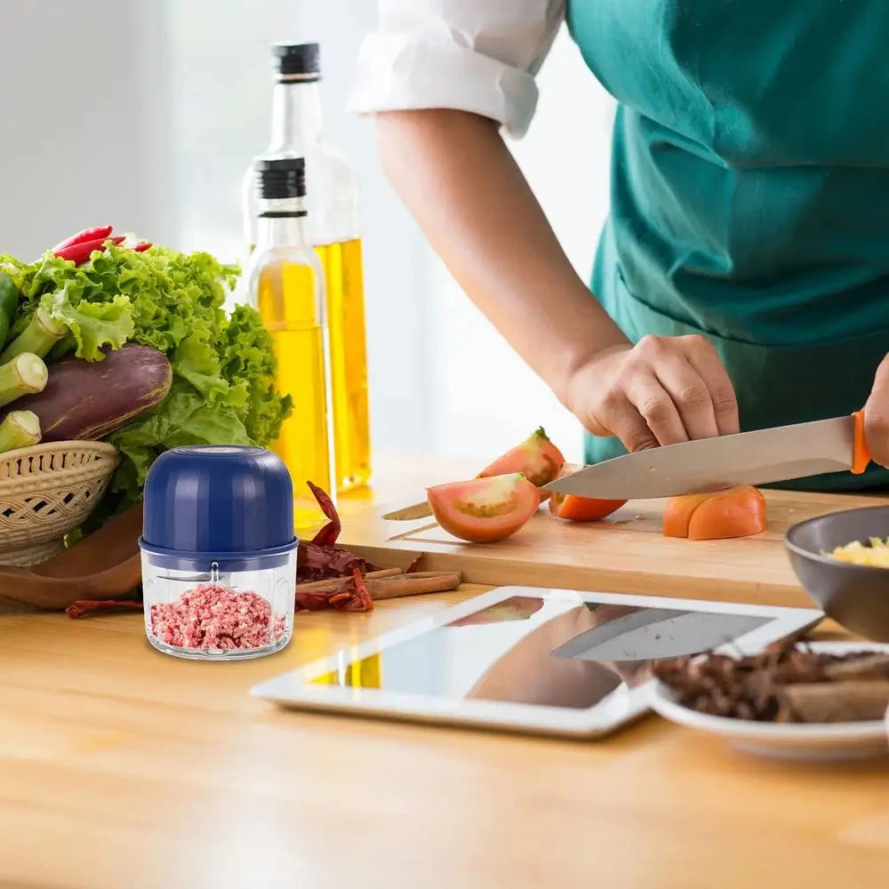 A hand is using a knife to cut ingredients on a wooden board, with fresh vegetables and spices visible.