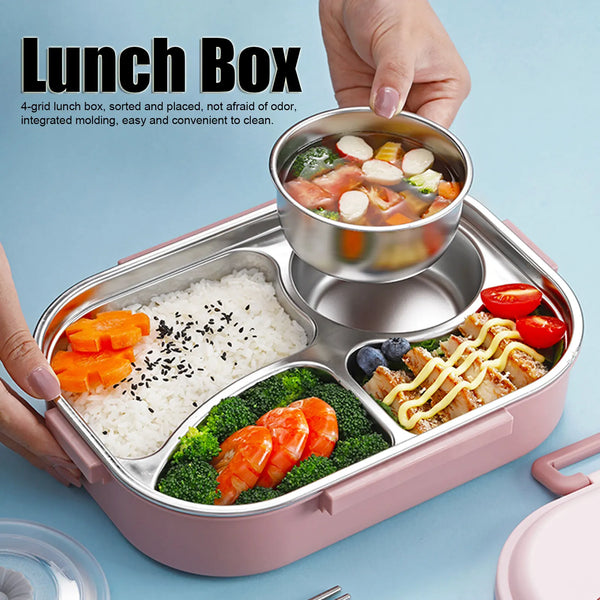 A hand holds a pink stainless steel bento lunch box filled with rice, salmon, and vegetables.