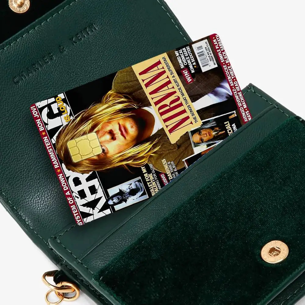 A dark green wallet features a debit card with Nirvana band anime stickers.