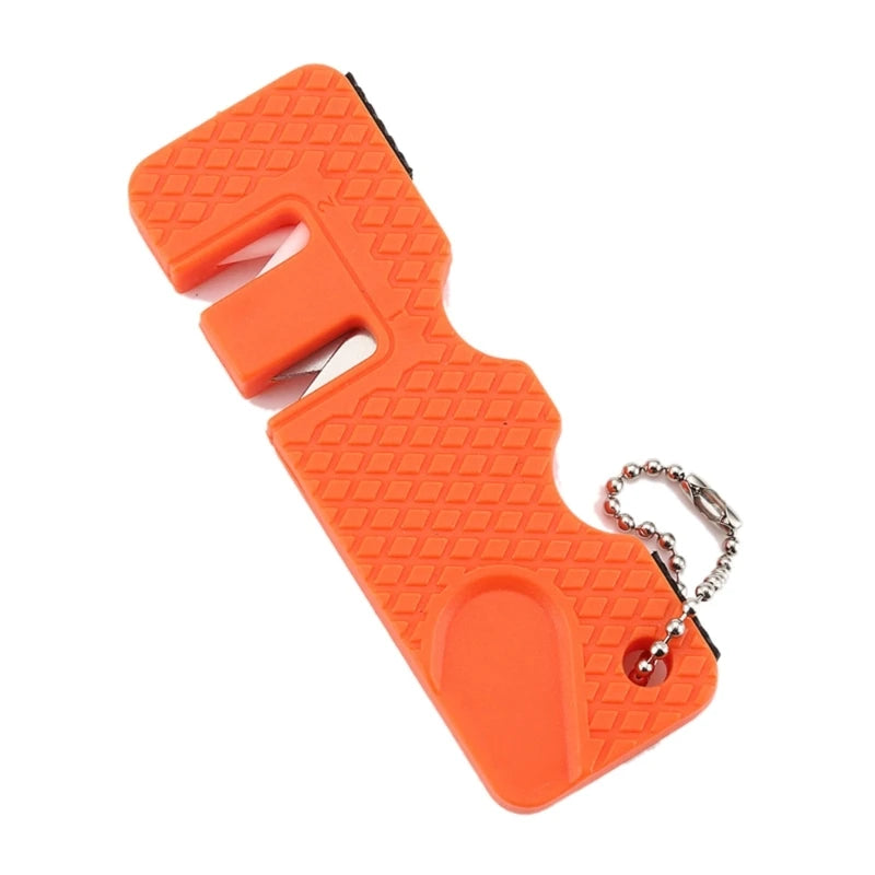 Orange portable mini knife sharpener keychain with a textured body and attached keyring