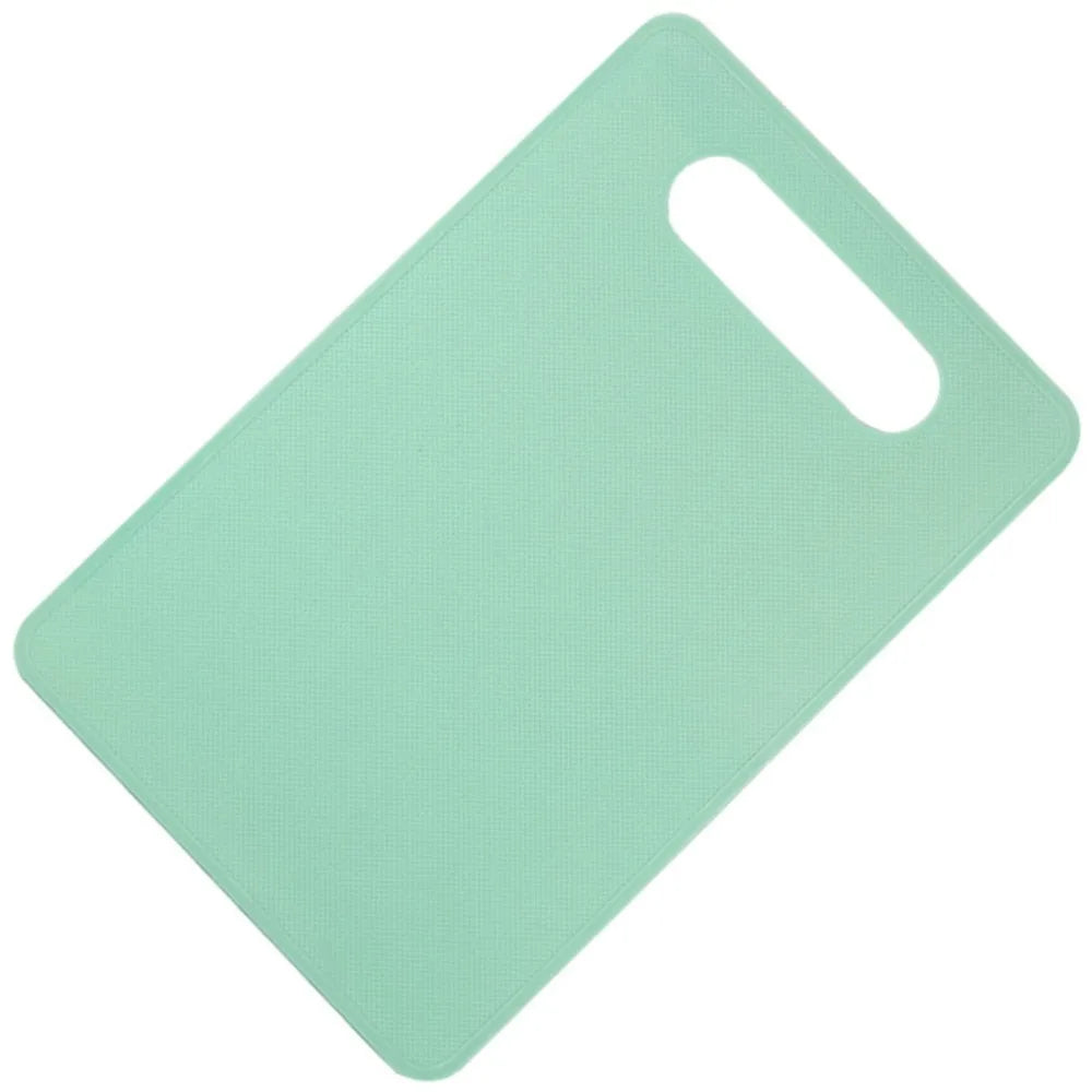 A light mint green plastic cutting board with a handle, shown from above.
