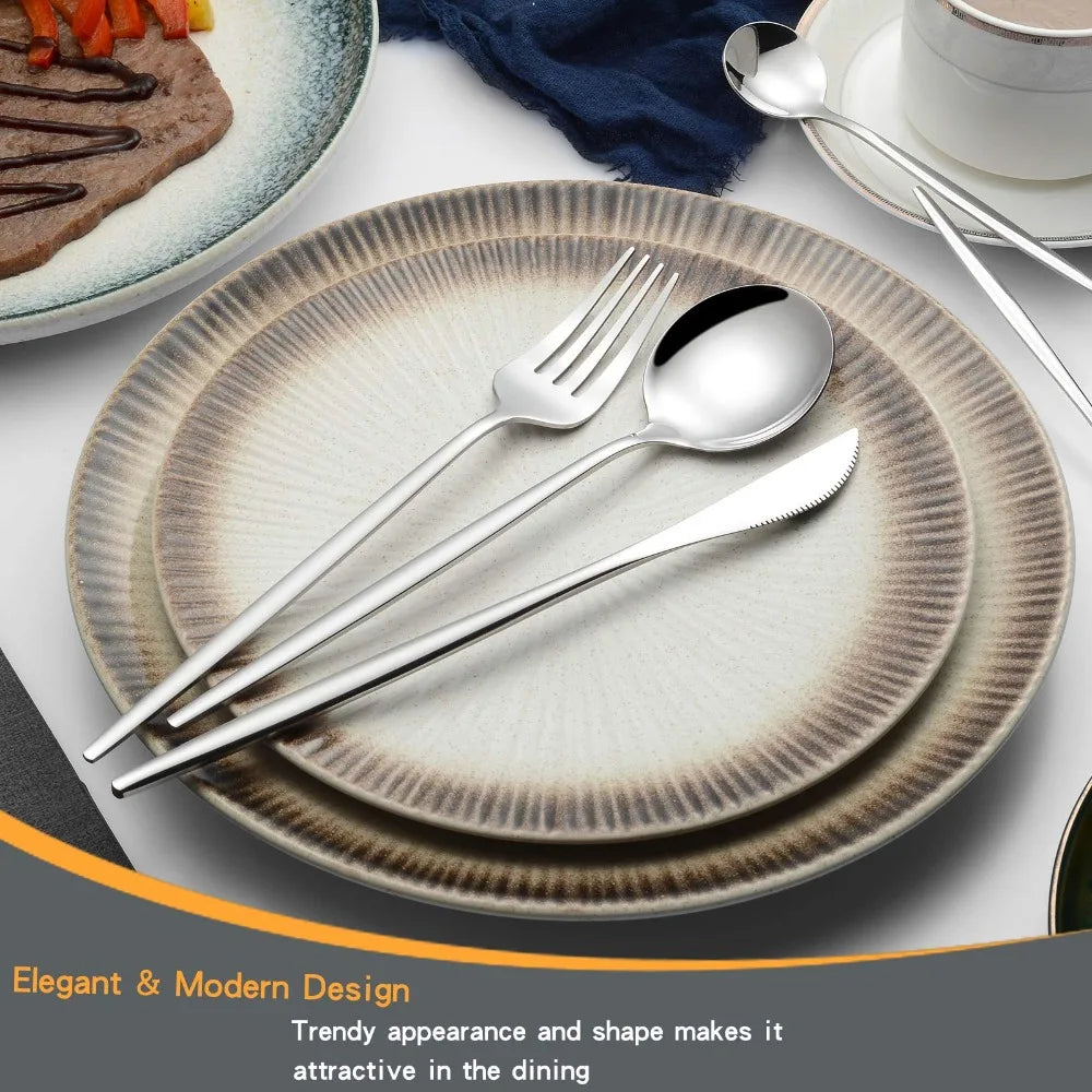 A set of four modern silver flatware pieces including a fork, knife, and spoon resting on stacked plates.