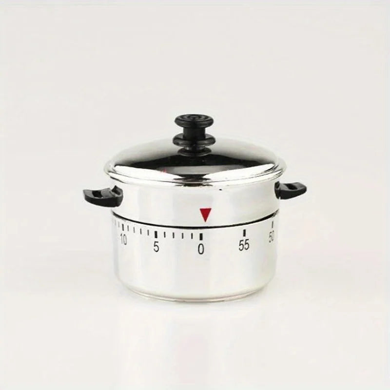 A silver mechanical kitchen cooking timer with a lid and a scale marked from 0 to 55.