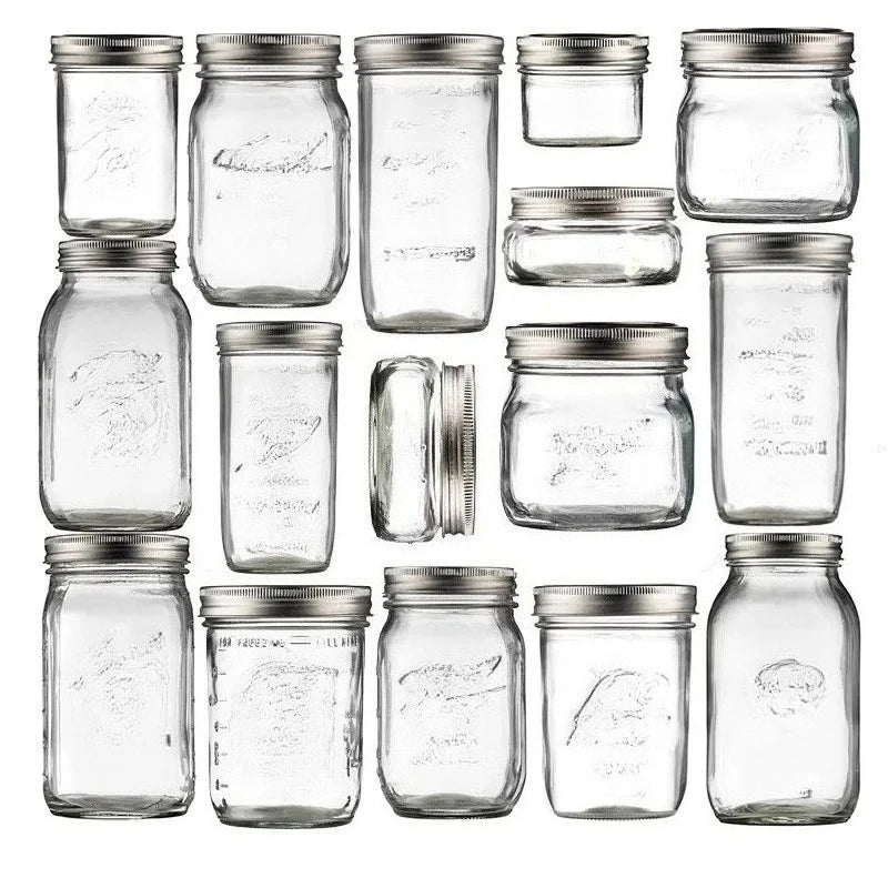 A collection of clear glass mason jars with metal lids arranged in a grid.