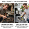 A man is using an electric grill brush to clean a grill grate in a backyard setting.