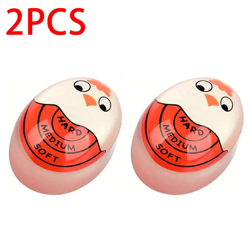 Two pink egg-shaped cooking timers with hardness markings hard medium soft