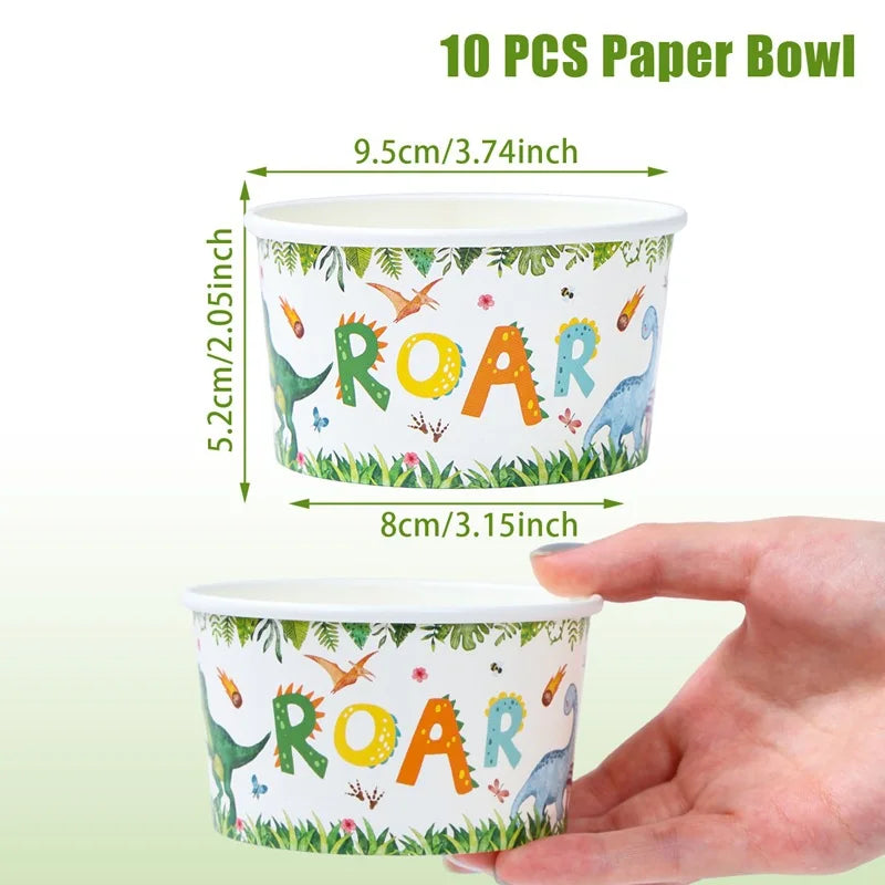 A hand holds a paper bowl featuring a dinosaur theme with the word ROAR printed on it.