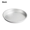A round, silver non-stick pizza baking pan with a perforated bottom.