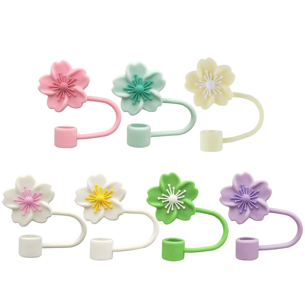 A set of five flower straw caps in pink, mint green, pale yellow, white, and purple for tumblers.