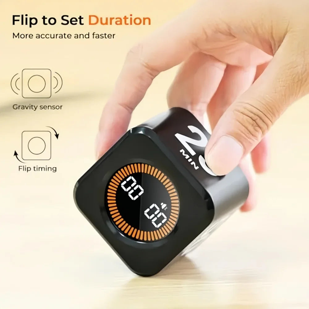 A hand is flipping a digital kitchen and study timer to set the duration on the device.