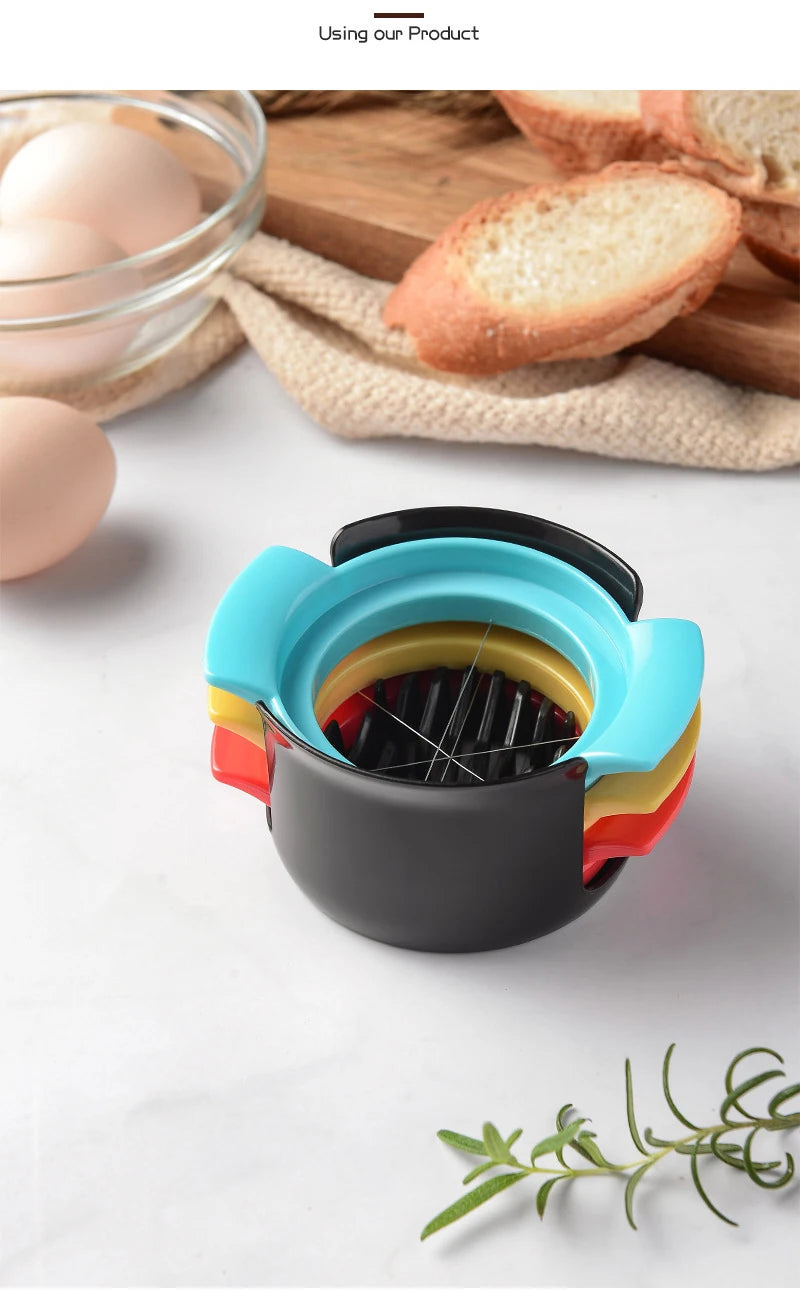 A multi-function egg cutter and beater tool with colorful plastic components resting on a white surface.