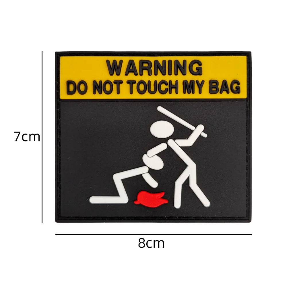 Black warning patch with yellow text DO NOT TOUCH MY BAG and a silhouette of a person with a red mark.