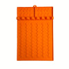 Orange silicone side burner rack and utensil storage mat with textured surfaces