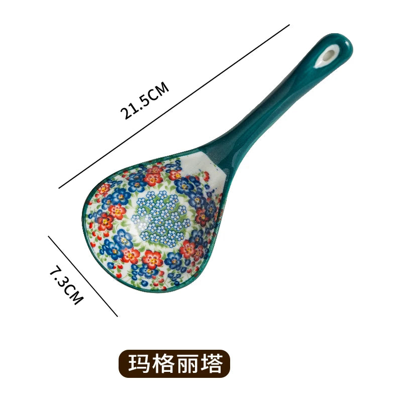 A teal ceramic ladle with a floral pattern, showing its dimensions.