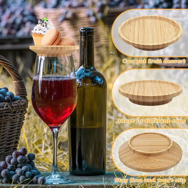 A glass of red wine next to a bottle and various round bamboo coasters for fruit desserts.
