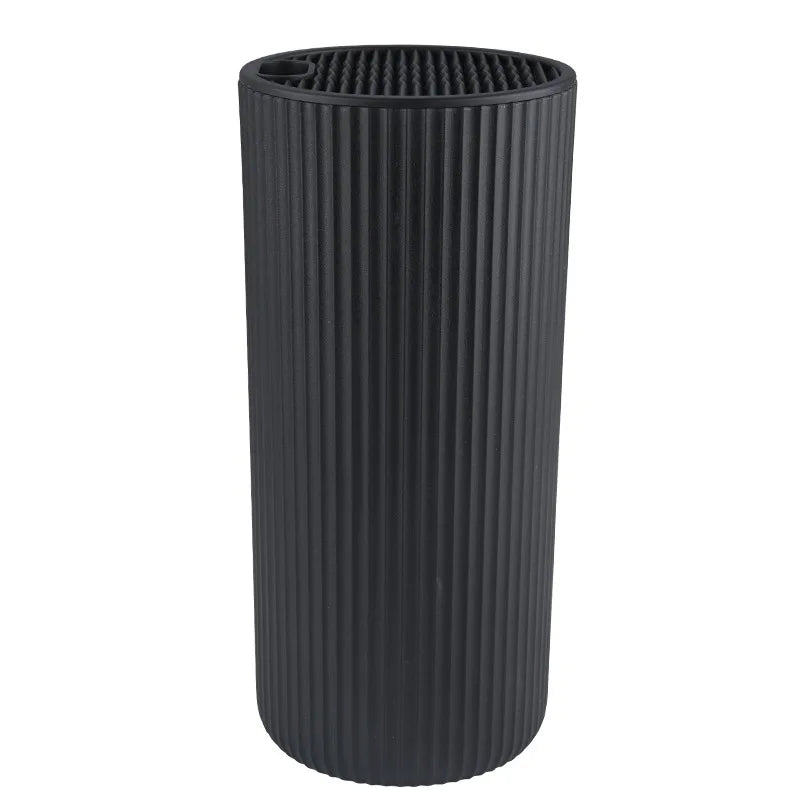 A black cylindrical knife block organizer with vertical ridges.