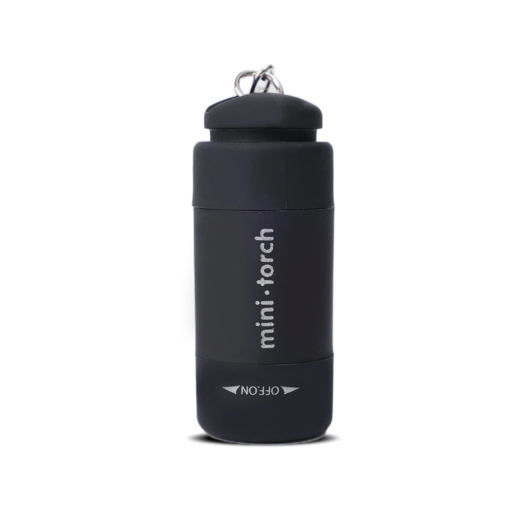 A black mini torch flashlight with a keychain loop is shown against a white background.