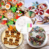 A collection of decorated cookies, icing tools, and a floral arrangement on a plate.