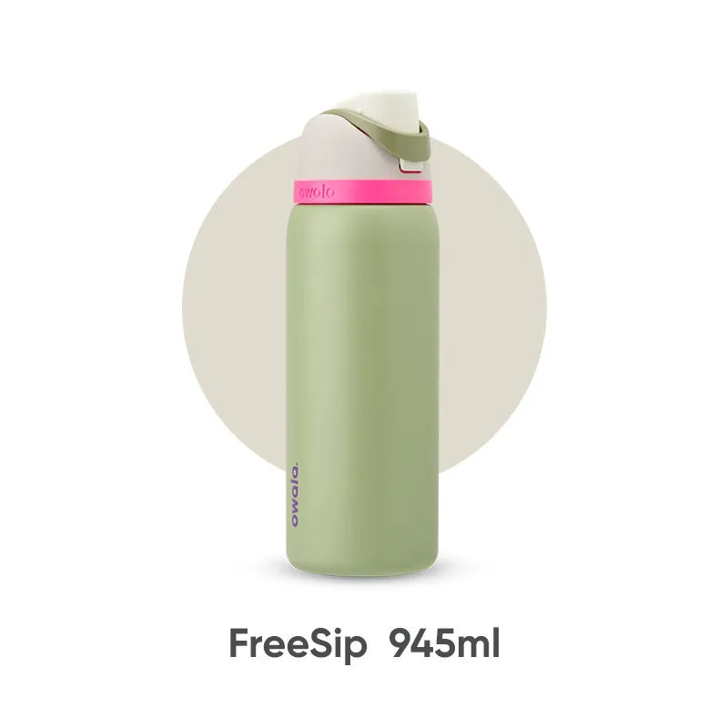 كوب سفر معزول باللون الأخضر الفاتح من FreeSip سعة 945 مل مع غطاء وردي.