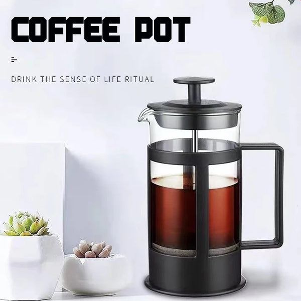 A black stainless steel French press coffee maker filled with brewed coffee, set against a white background.