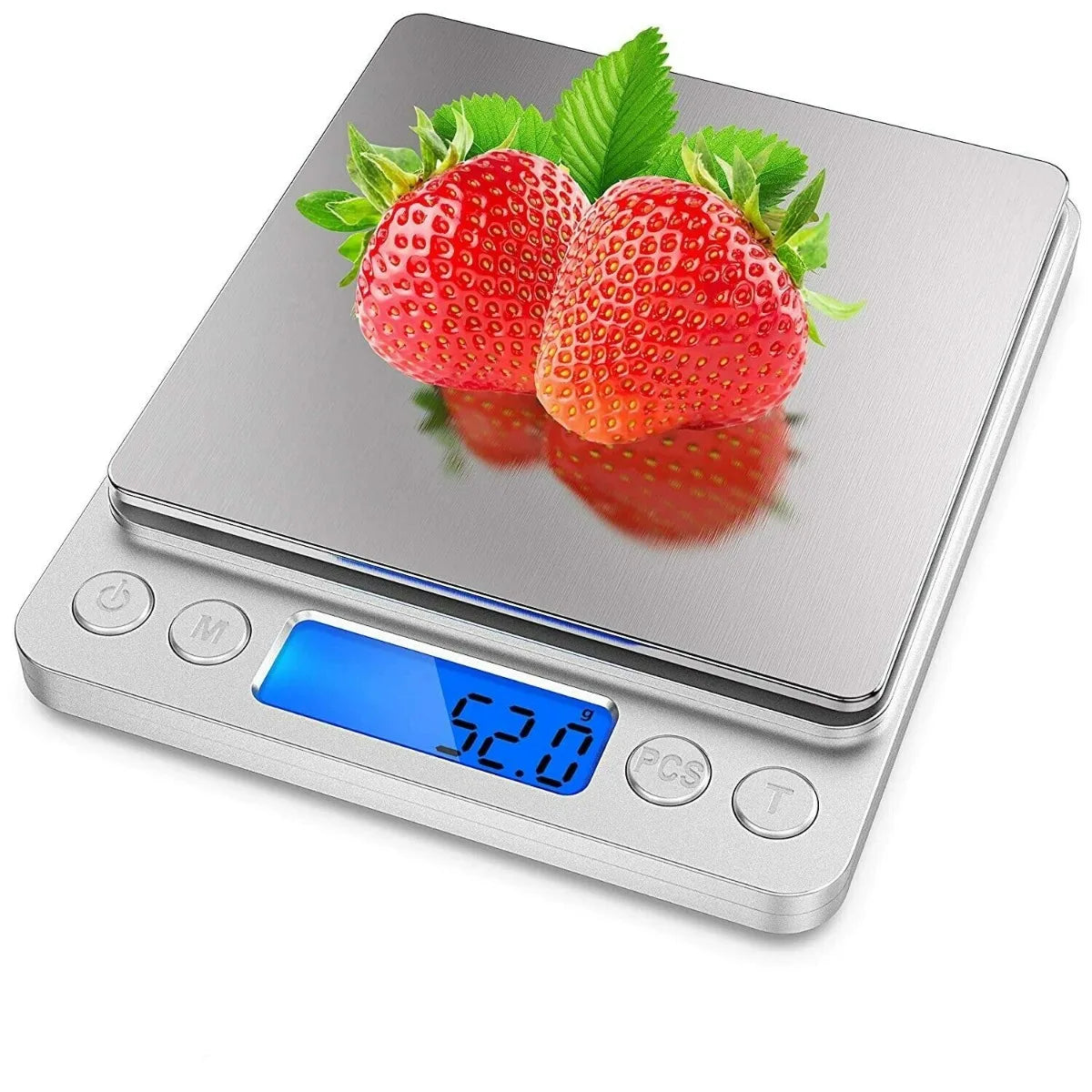 A silver digital kitchen scale displays a reading of 52.0 grams with fresh strawberries on the weighing platform.