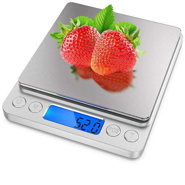 Silberweighter Küchenwaage zeigt eine Anzeige von 52,0 Gramm mit frischen Erdbeeren auf der Waage.