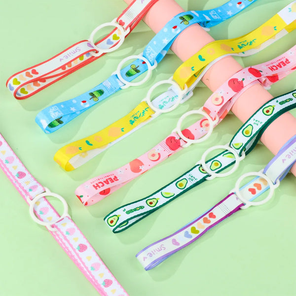 A collection of colorful adjustable straps for carrying water bottles, featuring various fruit and floral patterns.