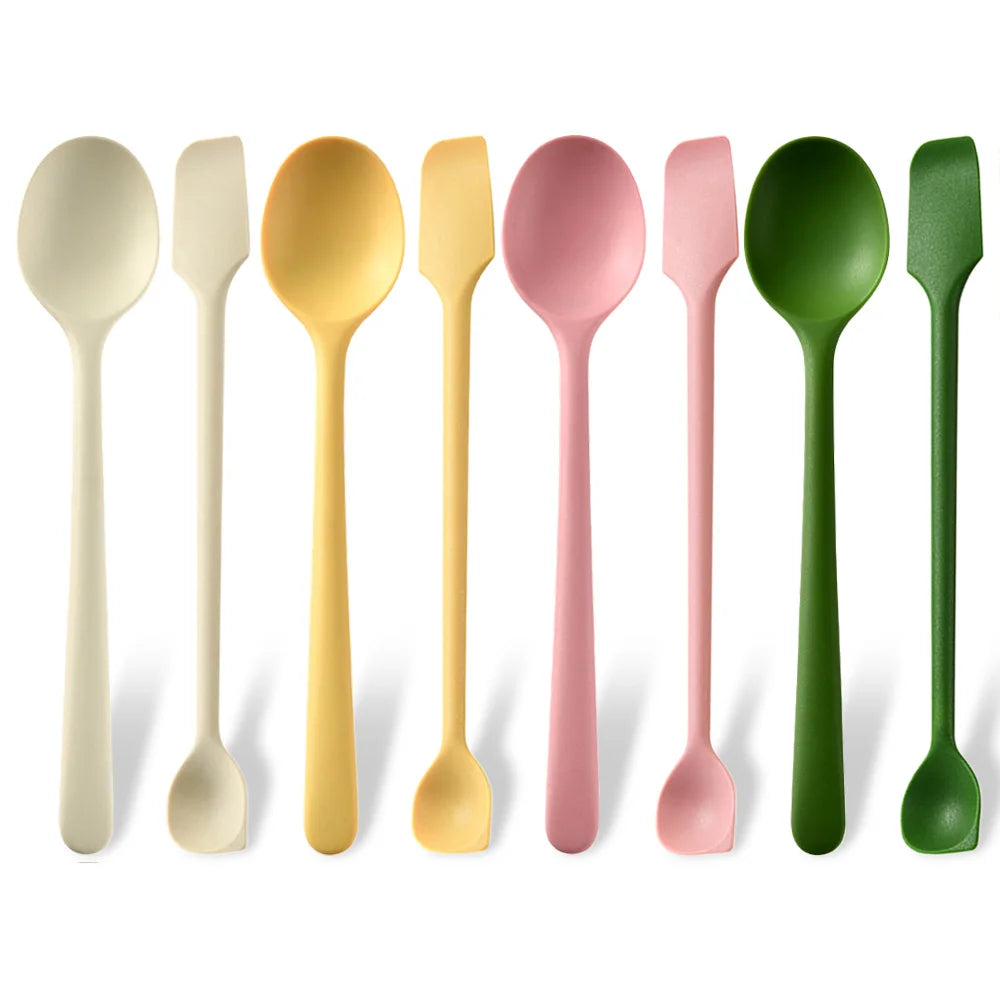 A row of silicone heat resistant spoons in various pastel and natural colors.