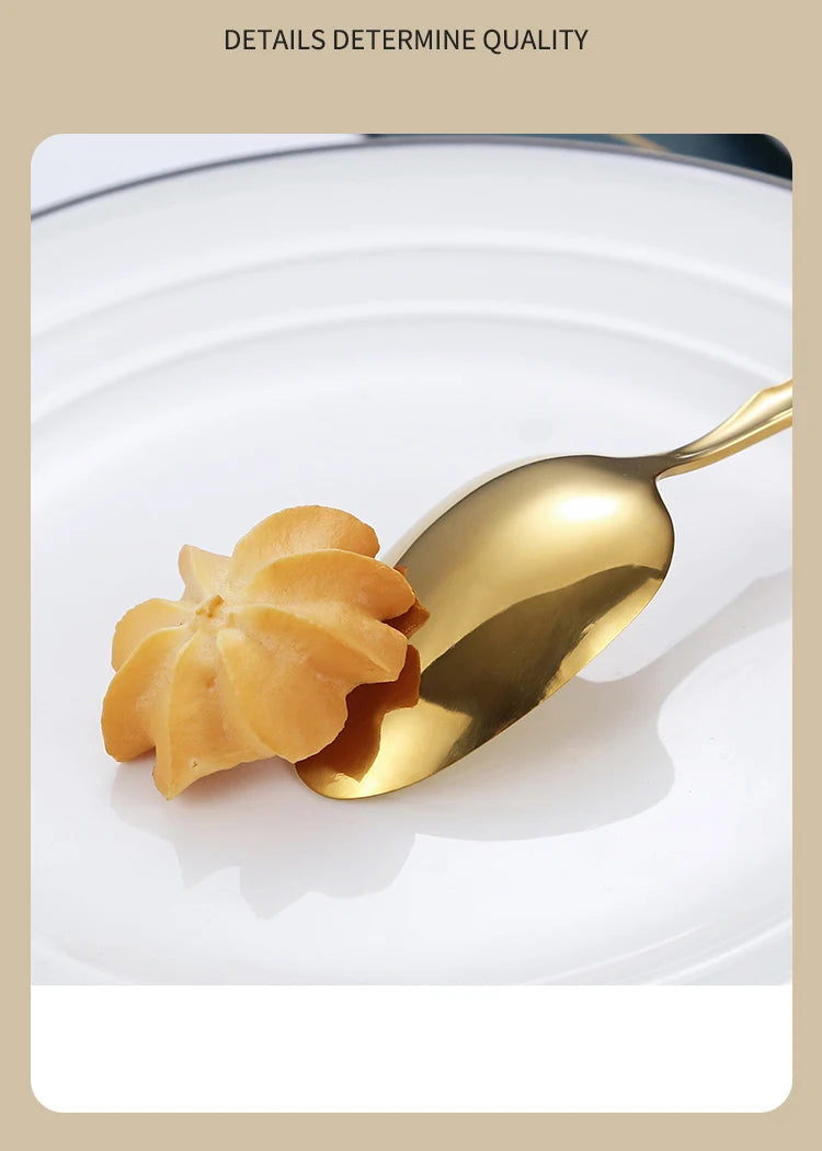 A spoonful of golden stainless steel dessert is placed on a white plate, highlighting the glossy finish.
