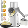 A white rotary kitchen grater and slicer is shown with various grating surfaces and shredded food products.