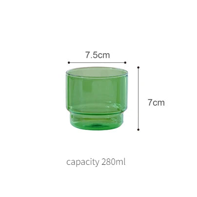A green glass teacup and mug set with dimensions 7.5cm by 7cm and a capacity of 280ml.
