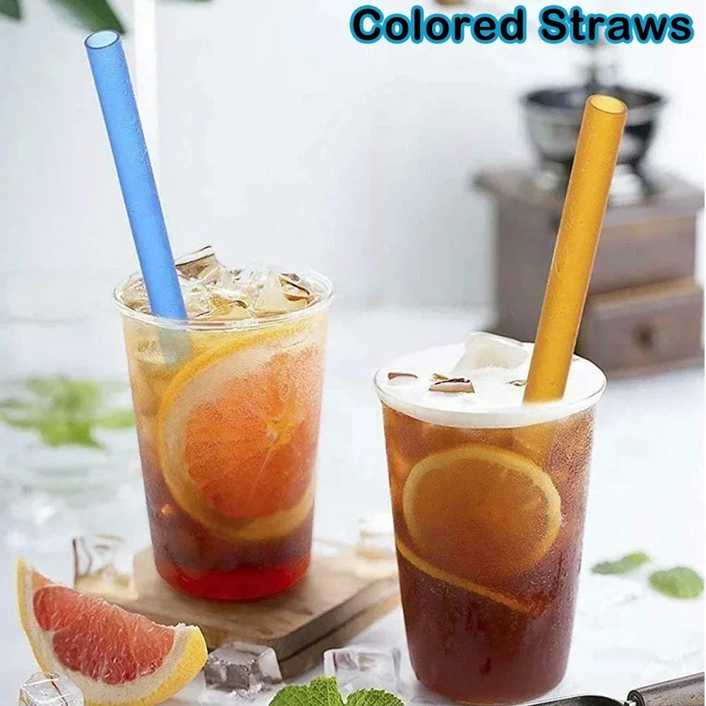 A glass of iced beverage with a colored straw, featuring orange and red tones.