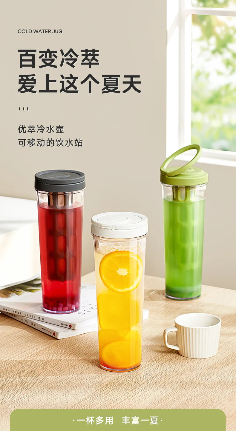 Three glass jars of cold water juice or drink sitting on a wooden table.