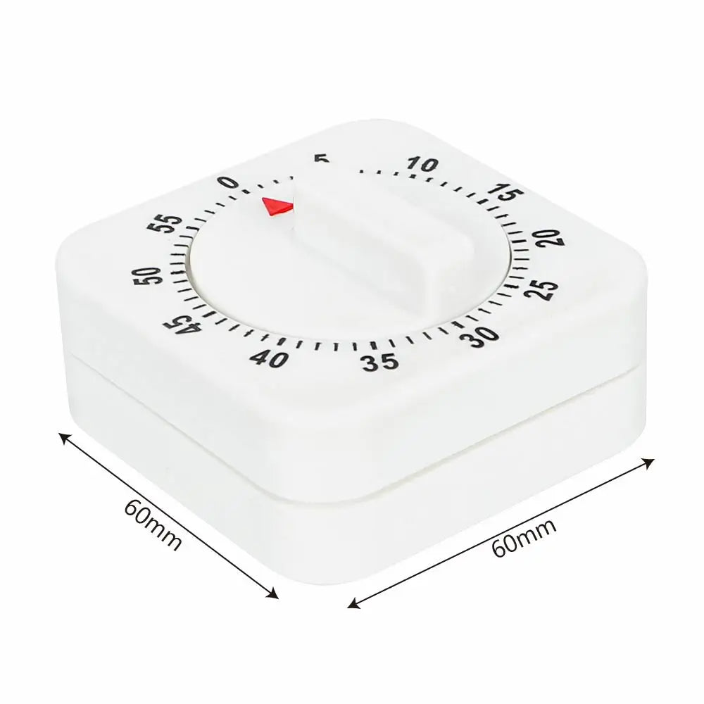 A white square mechanical kitchen timer with a rotating dial marked from 0 to 15.
