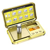 A gold-colored digital jewelry scale with a battery compartment and calibration guide is shown open.