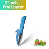 A blue ceramic fruit parer knife shown next to fresh vegetables.