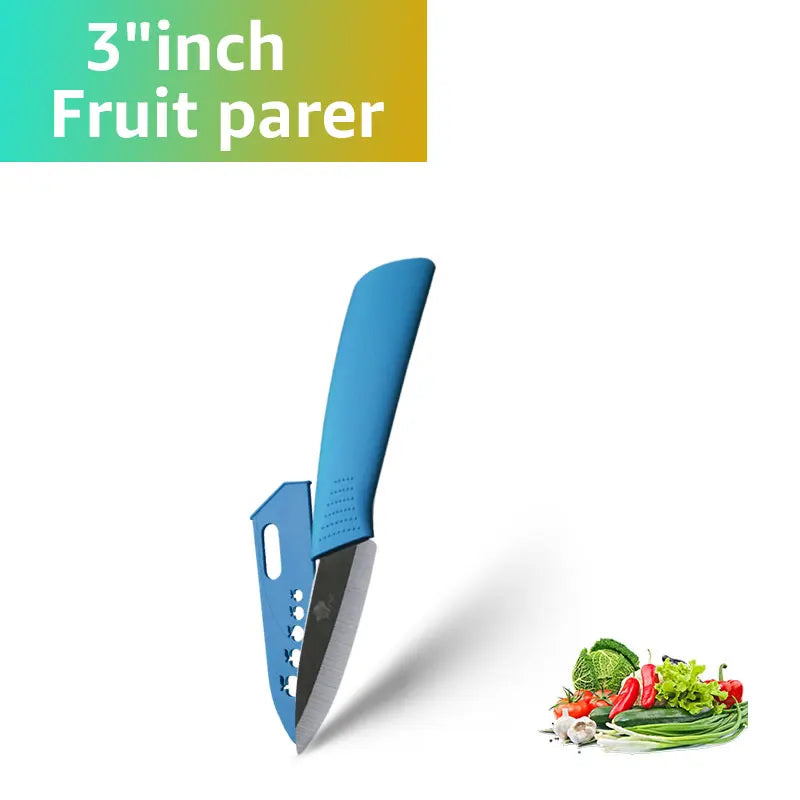 A blue ceramic fruit parer knife shown next to fresh vegetables.