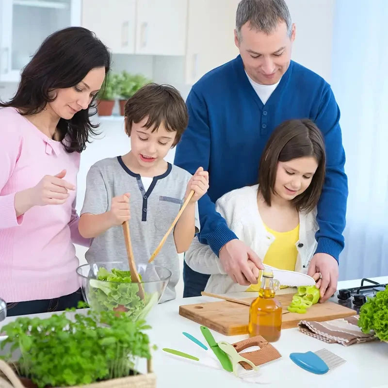 A family is preparing food with a kids plastic fruit and cake cutting set on a white table.