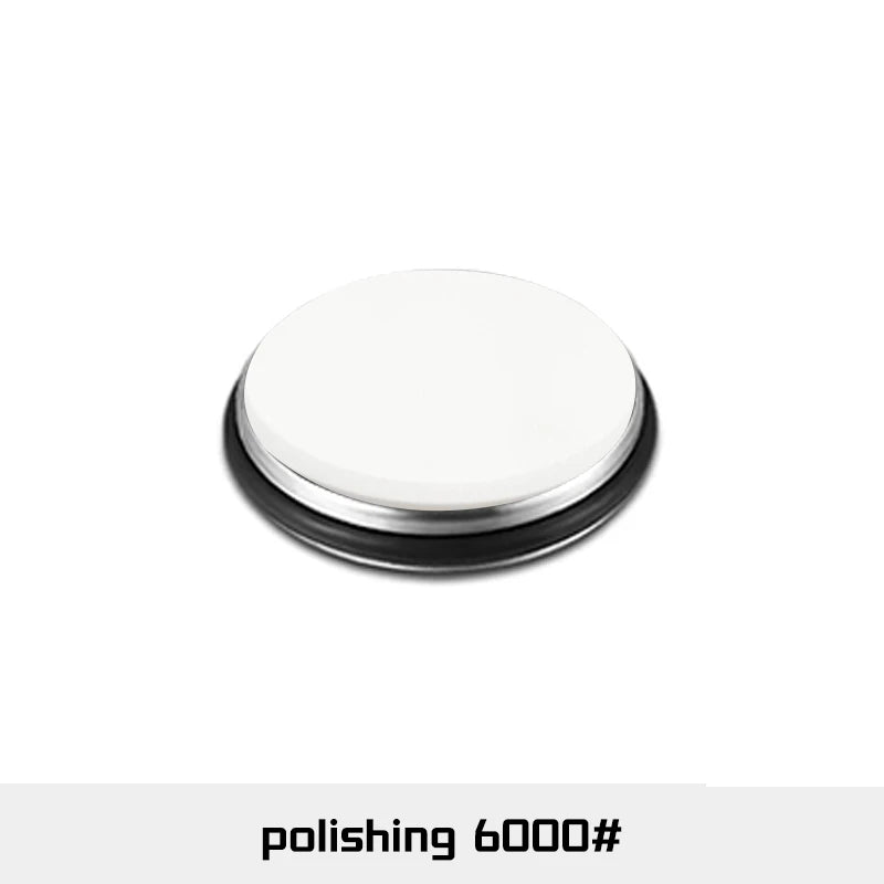 A round, silver-colored polishing disc used for knife sharpening.
