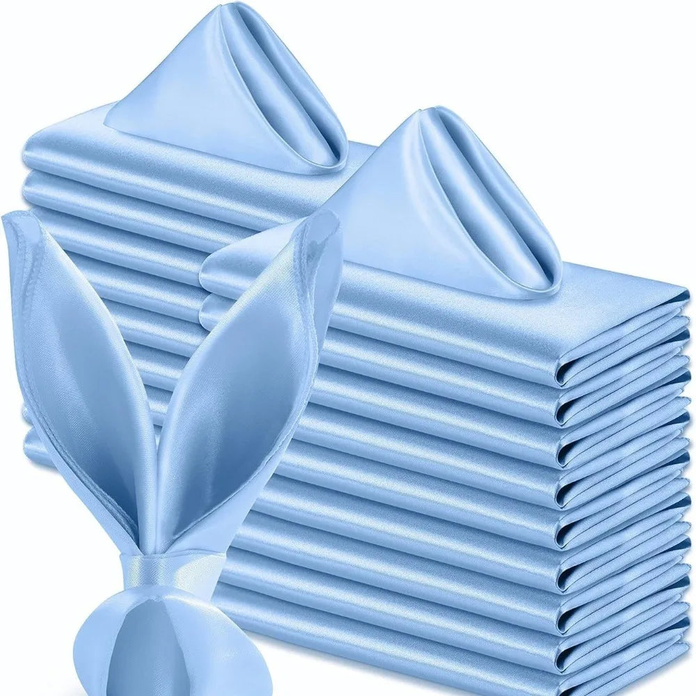 A stack of ten light blue satin dinner napkins folded neatly.