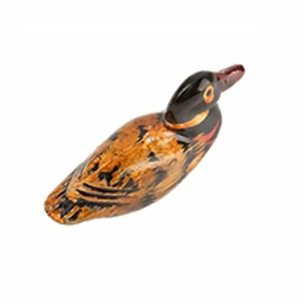 A silicone utensil holder and kitchen organizer shaped like a bird, featuring brown and black coloring.
