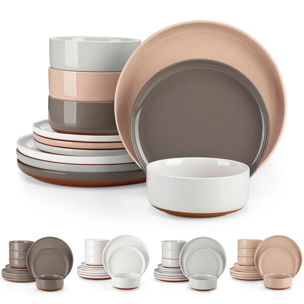 Set aus Steingut-Geschirr mit Tellern, Schalen und Tassen in matt-rosa Glasur.