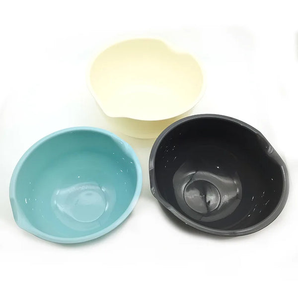 Two multi-sized plastic salad bowls, one pale yellow and one dark gray, are shown side by side.