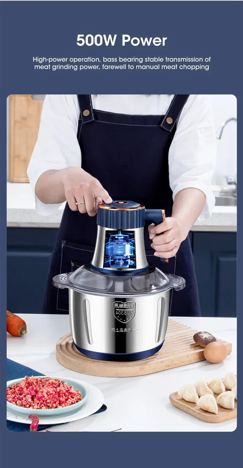 A person is operating a 500W electric meat grinder and food chopper with a stainless steel unit on a wooden cutting board.
