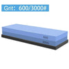A rectangular blue knife sharpening stone with markings for 600 and 3000 grit.