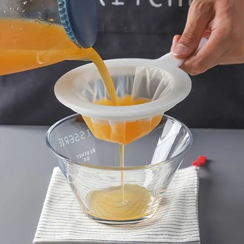 A hand pours orange juice from a blue container into a clear glass measuring cup.
