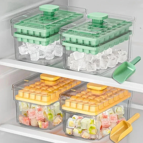 Clear plastic ice cube trays with green and yellow lids and storage boxes filled with ice cubes