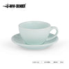 A light blue ceramic latte cup and saucer set.